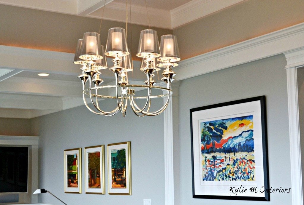 dining room chandelier in modern contemporary style new home with Benjamin Moore Stonington Gray and gallery style artwork display