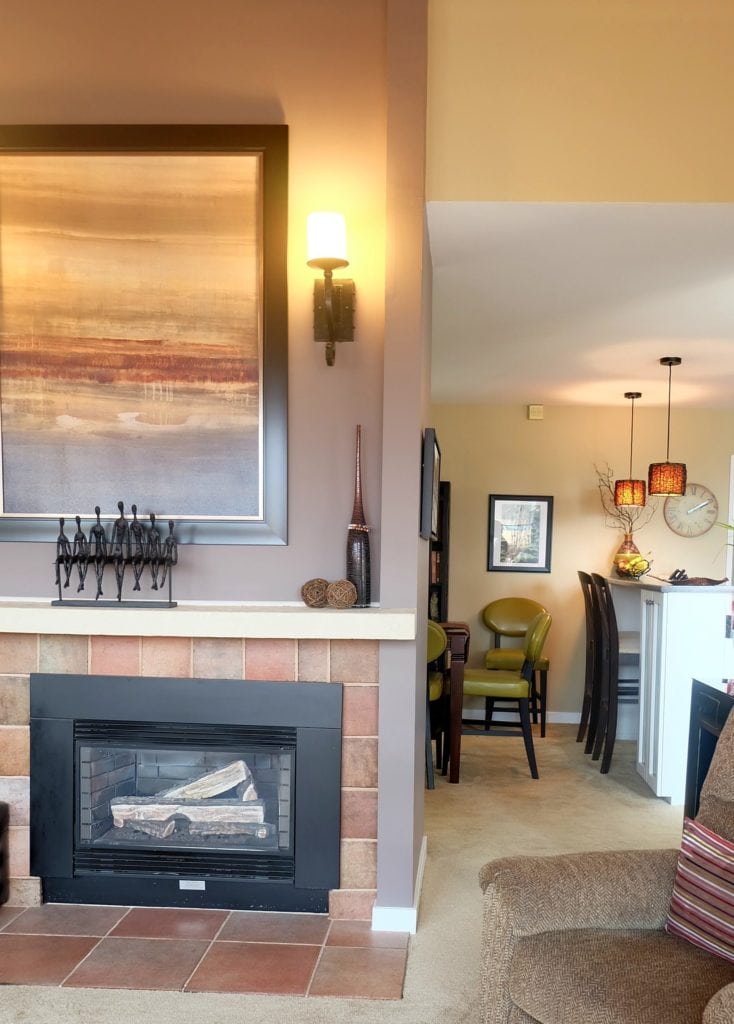 benjamin moore smoked oyster and stone house with tiled fireplace and green accents
