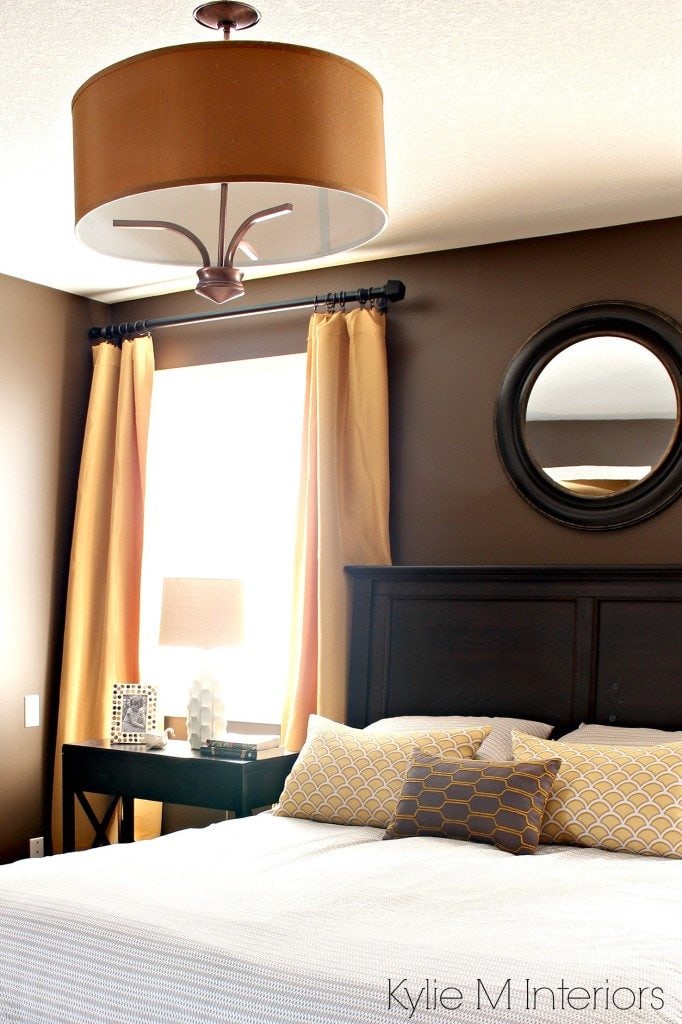 Bedroom painted Benjamin Moore Brown Horse, with gold, yellow and beige accents, dark wood headboard, side tables and home decor. Kylie M Interiors Decorating and Design Blog