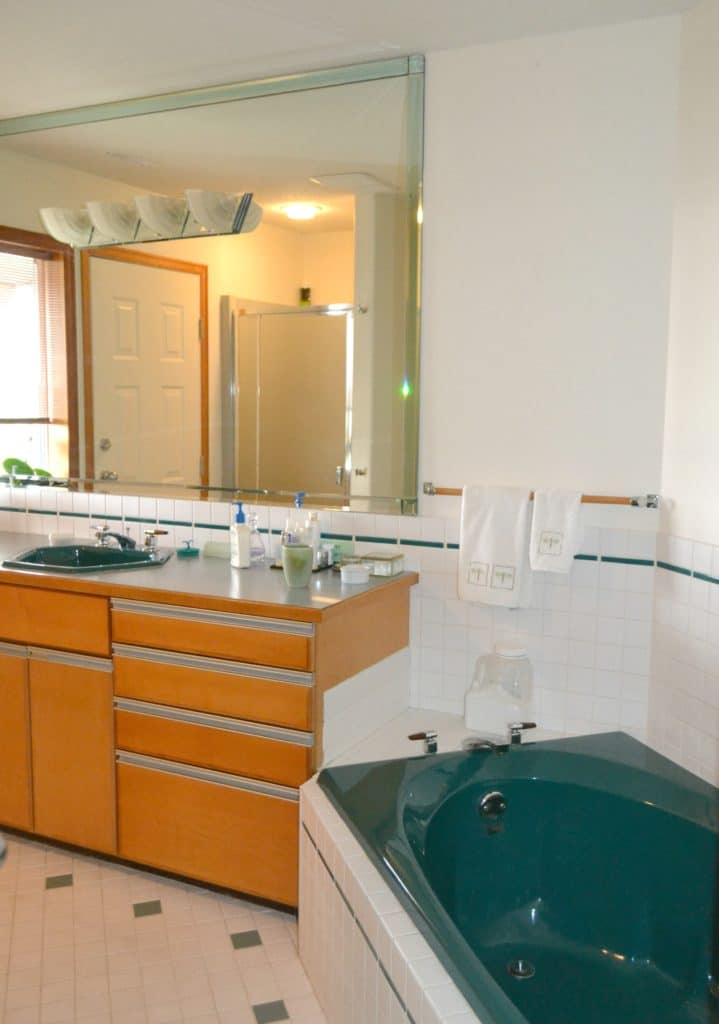 how to update and modernize forest green bathroom fixtures, tile, carpet, countertop and more by Kylie M Interiors. Ideas