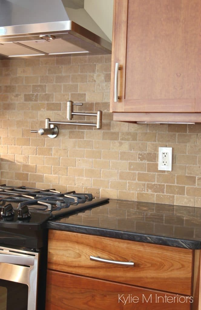 Natural cherry cabinets, black granite, travertine tile subway backsplash, pot filler, stainless steel