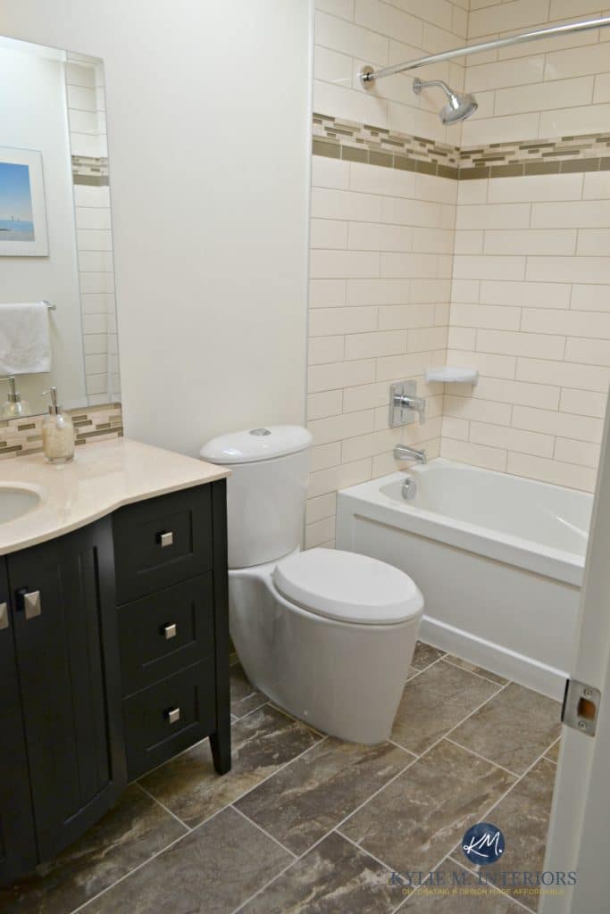 update to an almond bathroom with cream elongated subway tiles, espresso vanity and glass mosaic tile. Kylie M Interiors