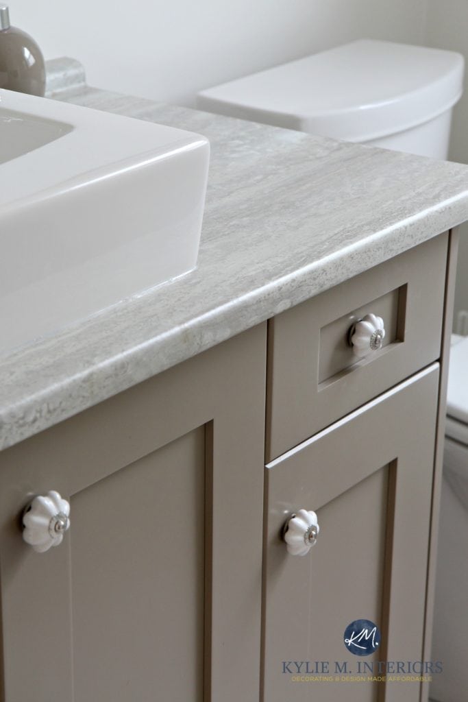 Bathroom vanity with travertine silver countertop, painted Benjamin Moore Kingsport Gray with white sink. Kylie M Interiors e-design