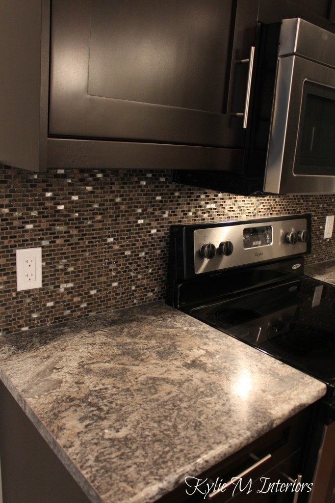 harold pionite laminate countertop, brown mosaic tile backsplash and espresso dark wood cabinets with chrome. Affordable kitchen update ideas