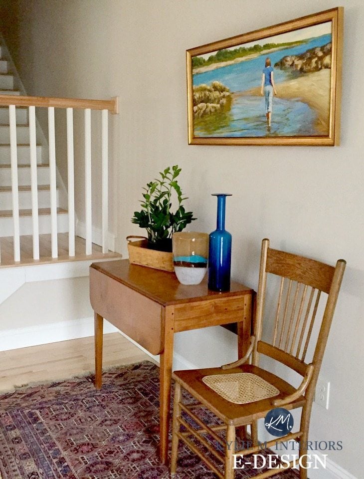 Sherwin Williams Canvas Tan in entryway with rustic warm toned pine wood furniture and decor. Kylie M E-design