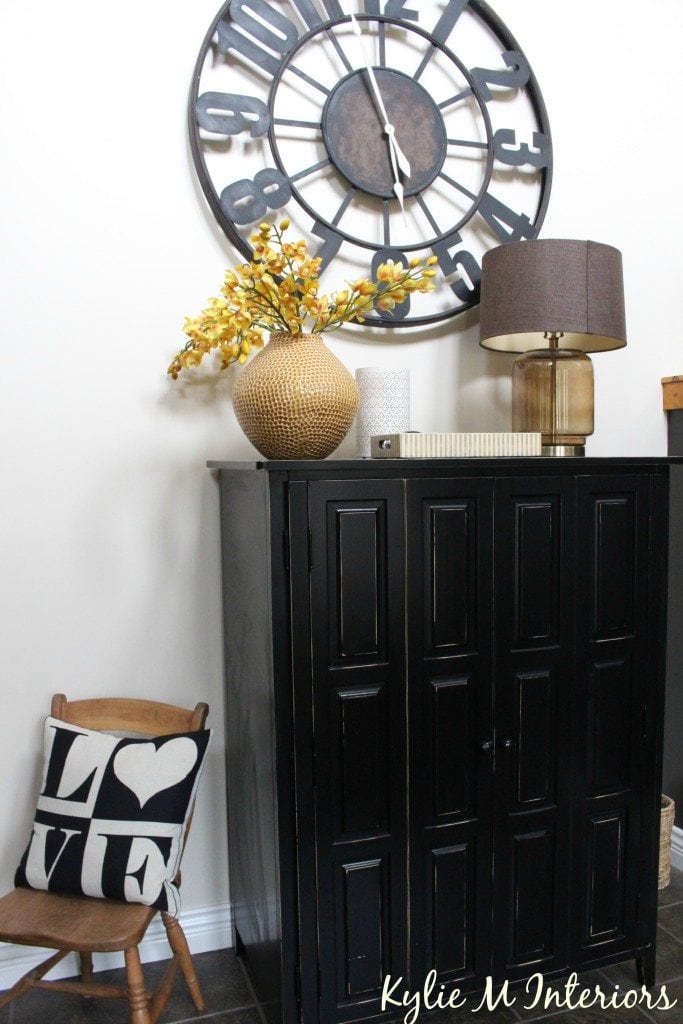 moore navajo white with entryway decor ideas including large overside metal clock and black armoire for storage