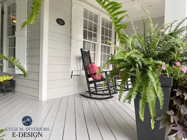 Exterior siding painted Sherwin Williams Knitting Needles on front porch, white trim, white shutters, Cheating Heart from door, west facing. Kylie M Interiors edesign