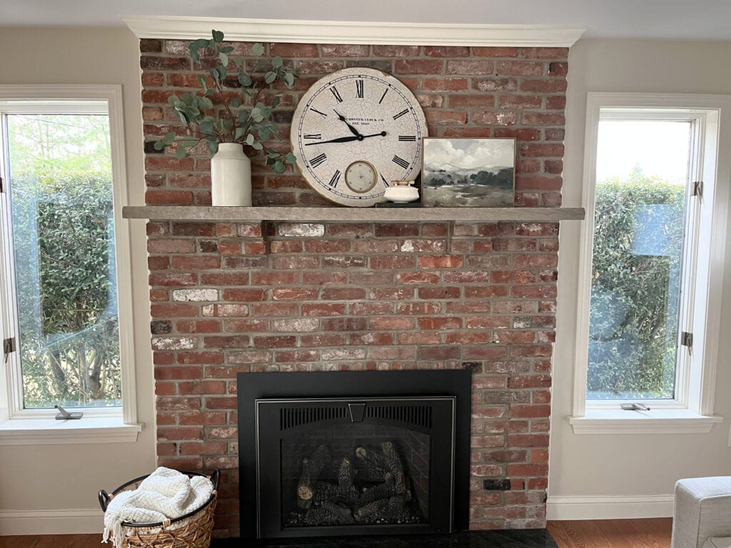 FIREPLACE UPDATE IDEAS, RED BRICK, WOOD MANTEL WITH HOME DECOR, WARM GREIGE OFF WHITE PAINT COLOR ON WALLS. KYLIE M INTERIORS CLIENT PHOTO