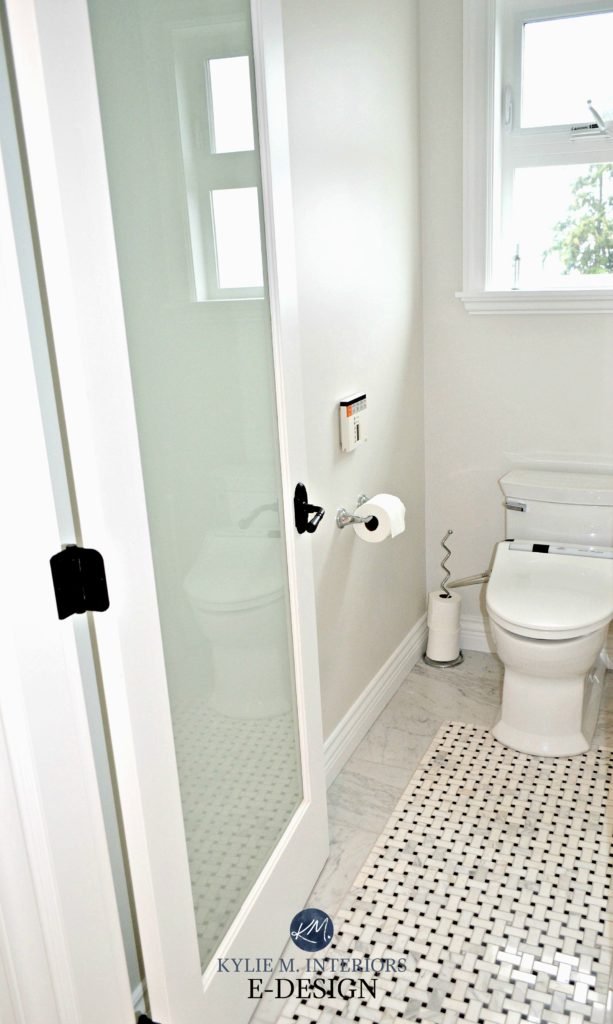 Bathroom with area for toilet with basketweave marble tile floor