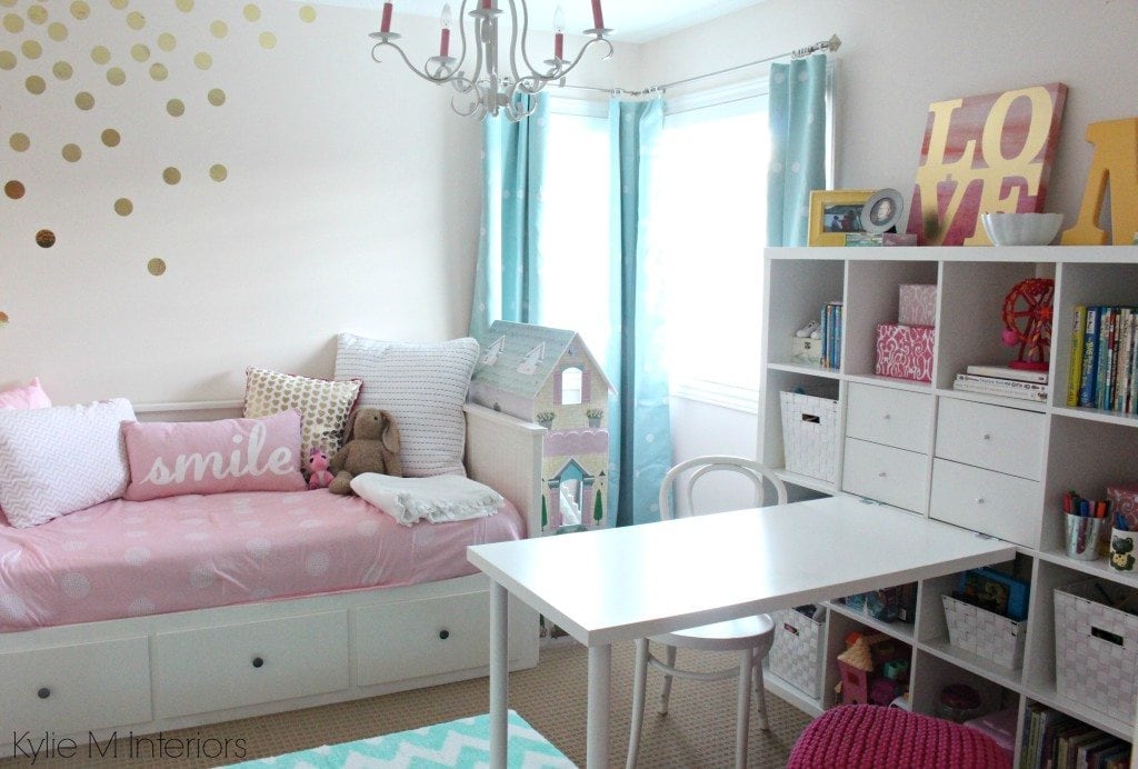 girls bedroom in benjamin moore pink bliss with chandelier, ikea hemnes bed and kallax bookshelf. Great organizing ideas with fun accent colours. Beautiful nursery palette as well