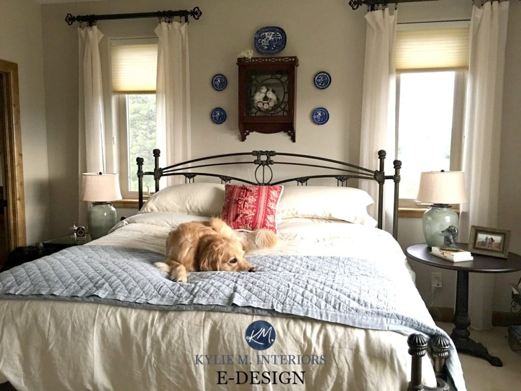 Sherwin Williams Accessible Beige in a country farmhouse style guest bedroom with wood trim and neutral bed linens. Kylie M E-design and ONline Color consulting