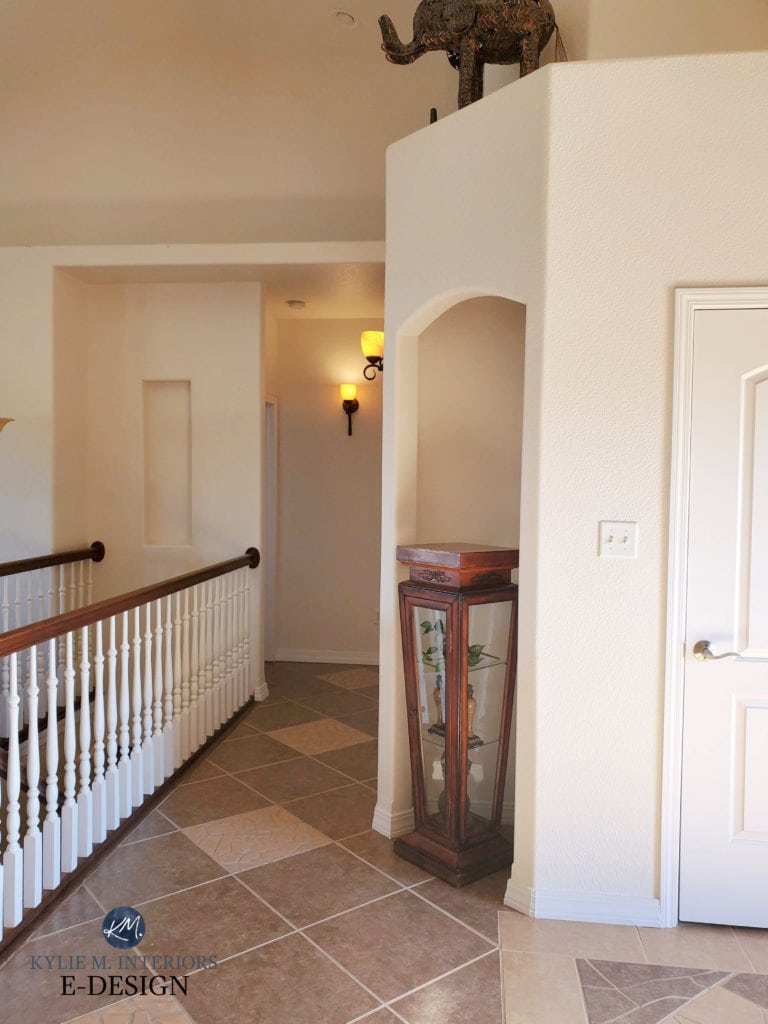 Hallway in Tuscan style home, travertine look tile floor with Sherwin Williams Divine White walls and off-white trim colour. Kylie M Interiors Edesign, update ideas