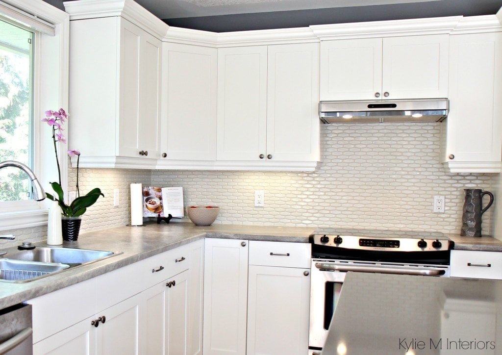 Maple cabinets painted Cloud White, Gray paint colour, quartz, hexagon subway tile cream backsplash and soapstone formica countertops