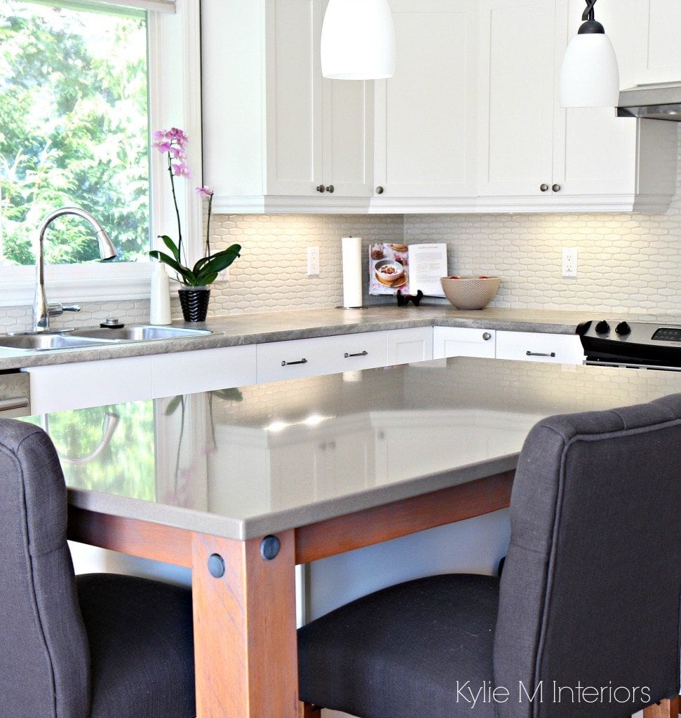 Quartz island with gray soapstone formica countertops Maple cabinest painted Cloud White, hexagon subway tile backsplash and rustic reclaimed wood on island