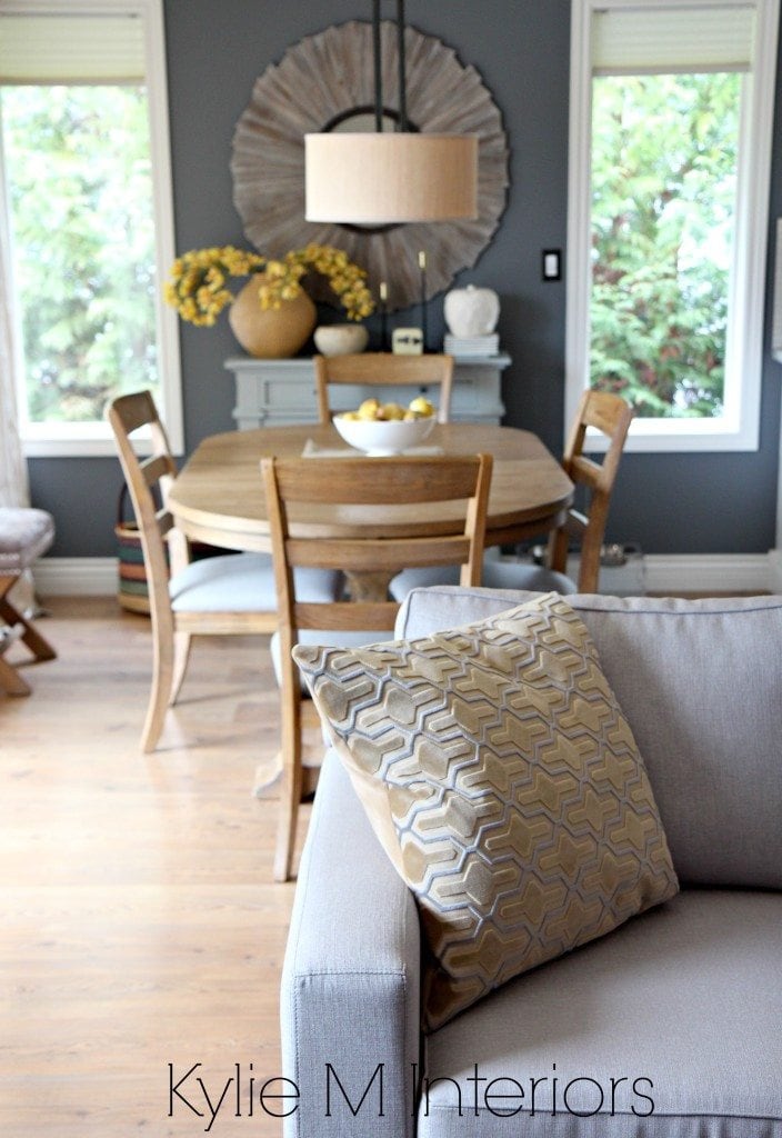 View from open layout living room to dining room with subtle modern country, light woods and farmhouse style home decor by Kylie M Interiors