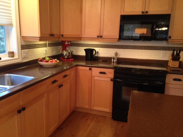 maple kitchen before cabinets were painted and new countertop and backsplash