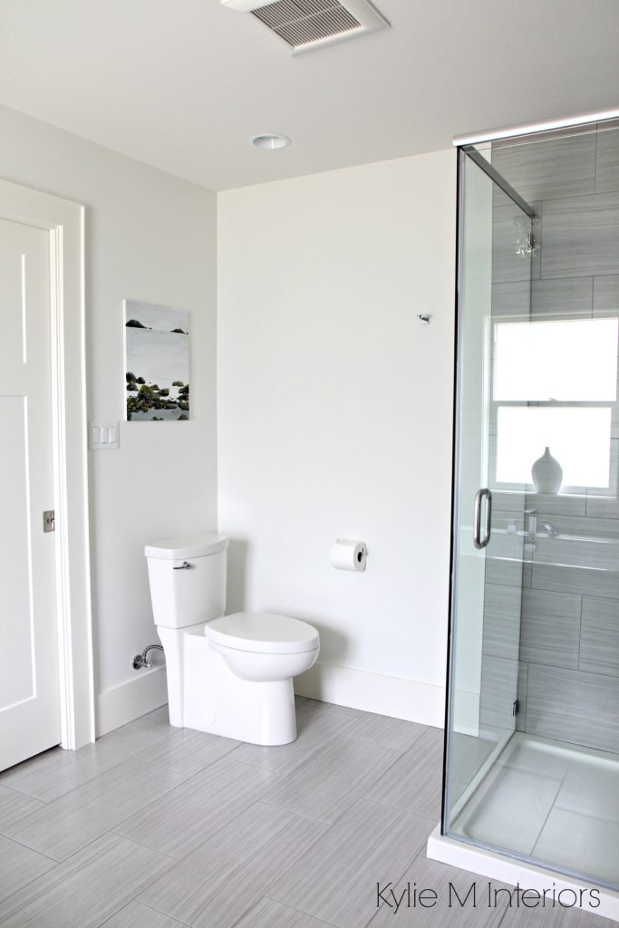 Bathroom Benjamin Moore Oxford White, toilet, linear porcelain floor and walk in shower tile by Kylie M Interiors E-Design and Consulting