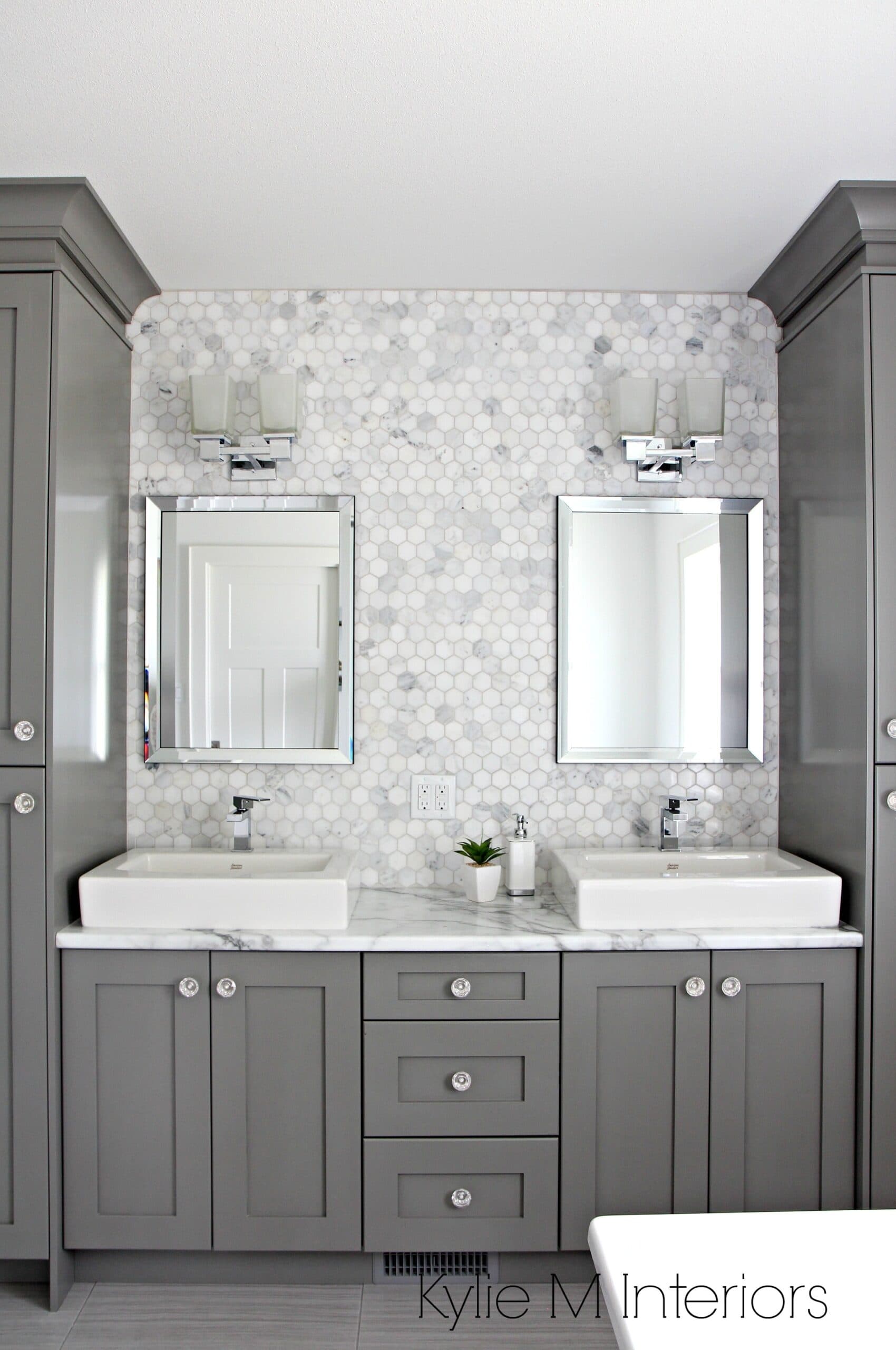 Double vanity in bathroom painted Benjamin Moore Chelsea Gray, hexagon mosaic tile backsplash, Calacatta Marble countertop by Formica. Design by Kylie M Interiors