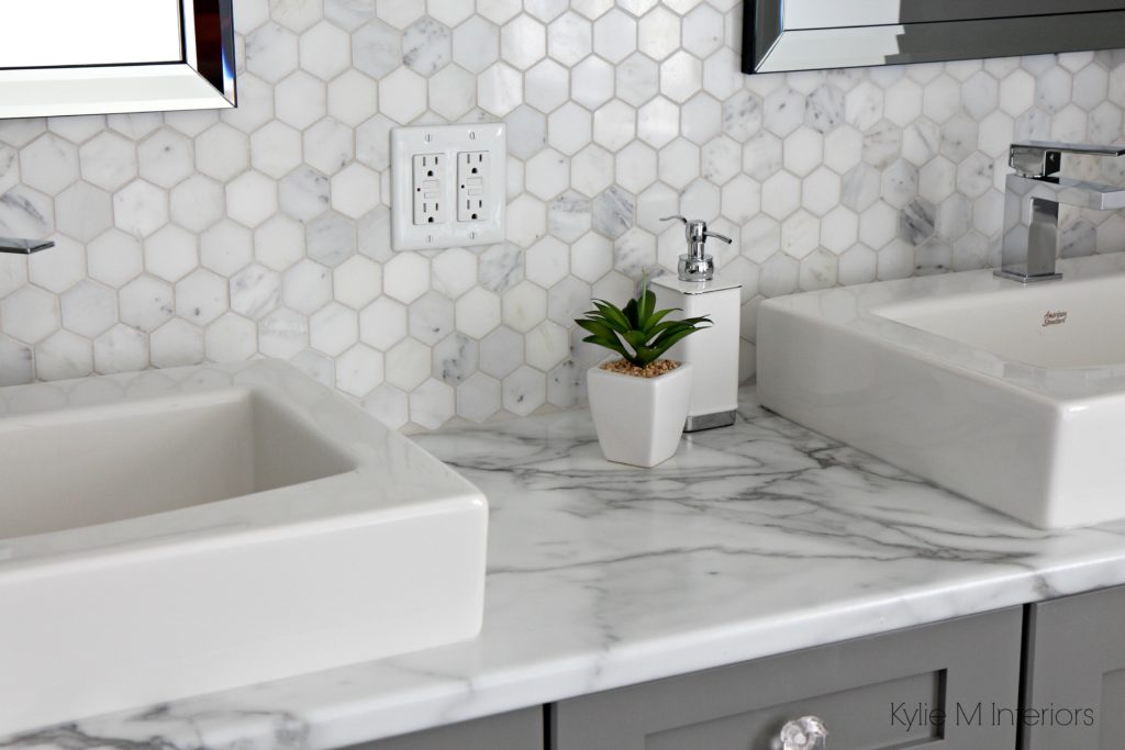 Formica 180FX Calacatta Marble laminate countertop with hexagon marble accent tile and Benjamin Moore Chelsea Gray painted cabinet by Kylie M Interiors