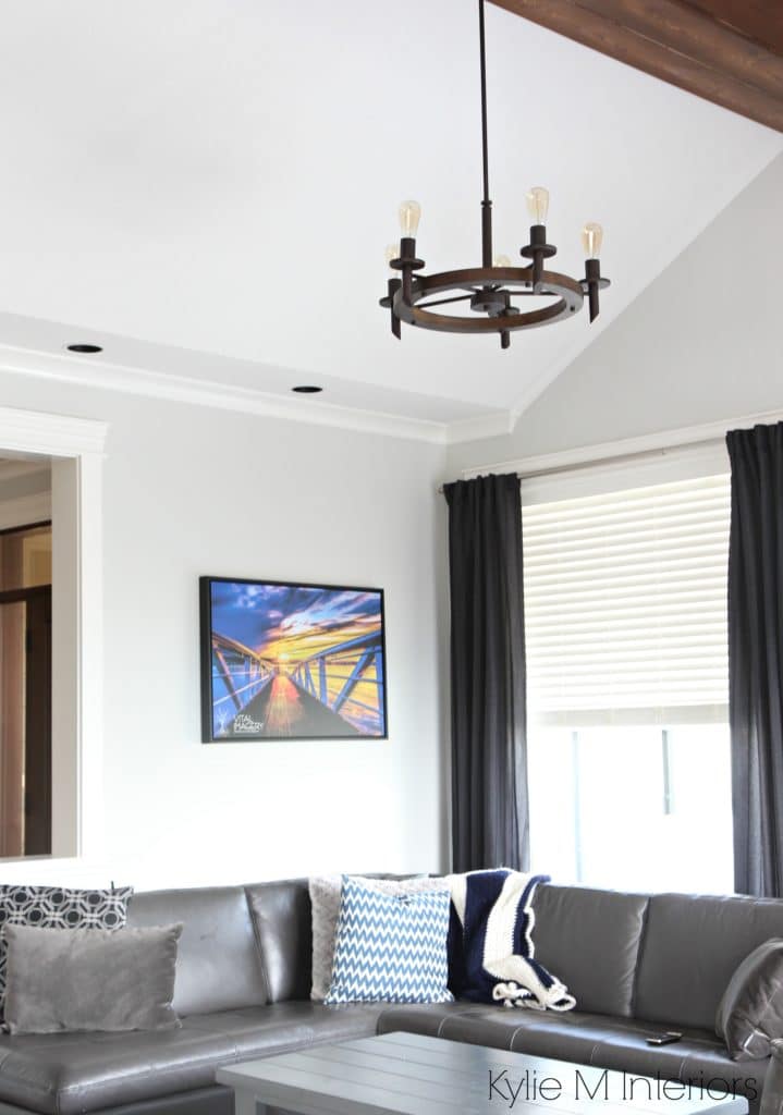 Living room with flat finish ceiling paint, no sheen. Benjamin Moore Gray Owl walls and rustic reclaimed beam, chandelier
