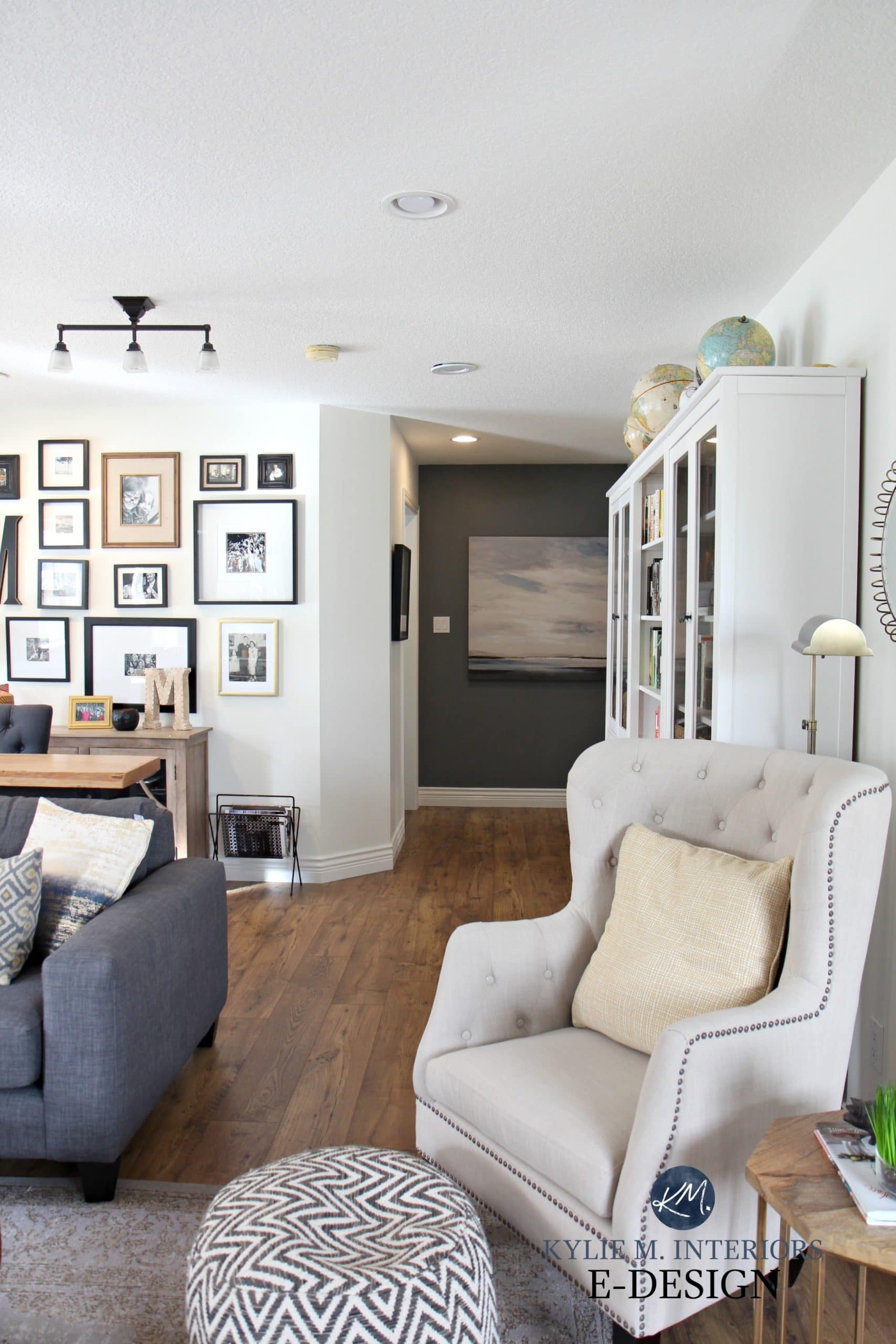 Feature wall in hallway with Benjamin Moore Steel Wool, Sherwin Creamy, gallery wall. Kylie M E-design