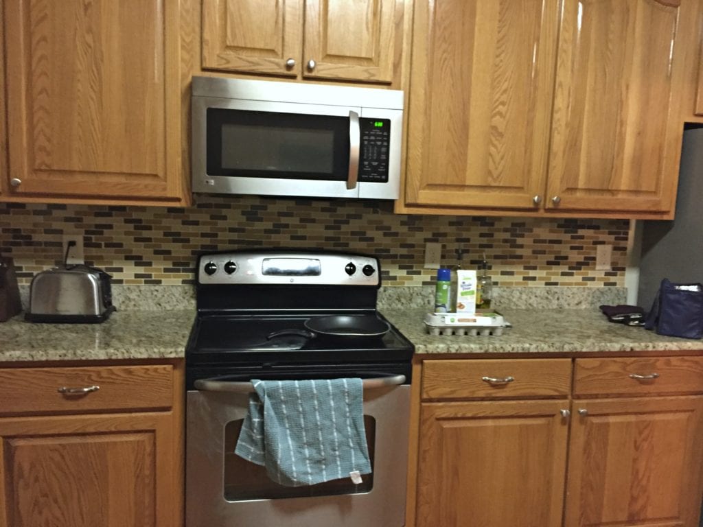 oak-cabinets-with-green-tones-before-being-painted-kylie-m-interiors-e-decor