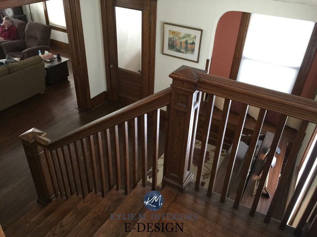 Dark wood trim, stairs and doors in older home entryway, best paint colour soft white, similar to SW White Duck or Alabaster. Kylie M INteriors E-design, before image. Client design