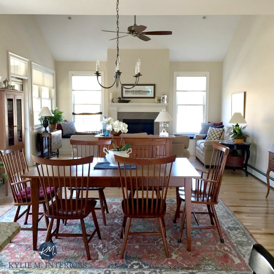 Sherwin Williams Canvas Tan in open layout living and dining with vaulted ceilings and fireplace. Kylie m Interiors paint colour