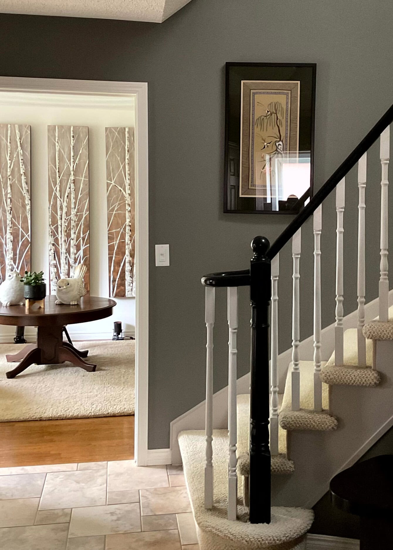 Entryway, beige tile, tan carpet, Benjamin Moore Chelsea Gray paint color on walls, Dove Wing living room, wood floor, black and white stair railing (1)