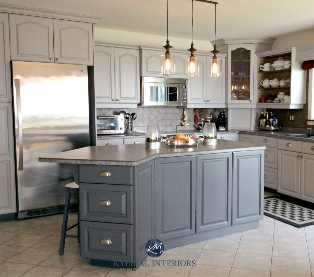 Oak kitchen cathedral cabinets painted Benjamin Moore Baltic Gray and Gray 2121-10. With beige floor tile. Kylie M INteriors E-design and online color consulting expert and blogger