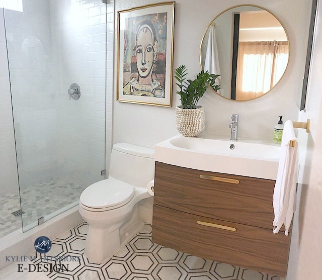 Sherwin Williams First Star in bathroom with hexagon marble floor and floatin vanity. Kylie M INteriors Edesign, onine paint color consultant
