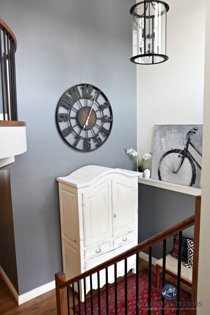 2 storey foyer, entryway with round large clock, white armoire, Benjamin MOore Steel Wool and Sherwin Williams Creamy by Kylie M Interiors