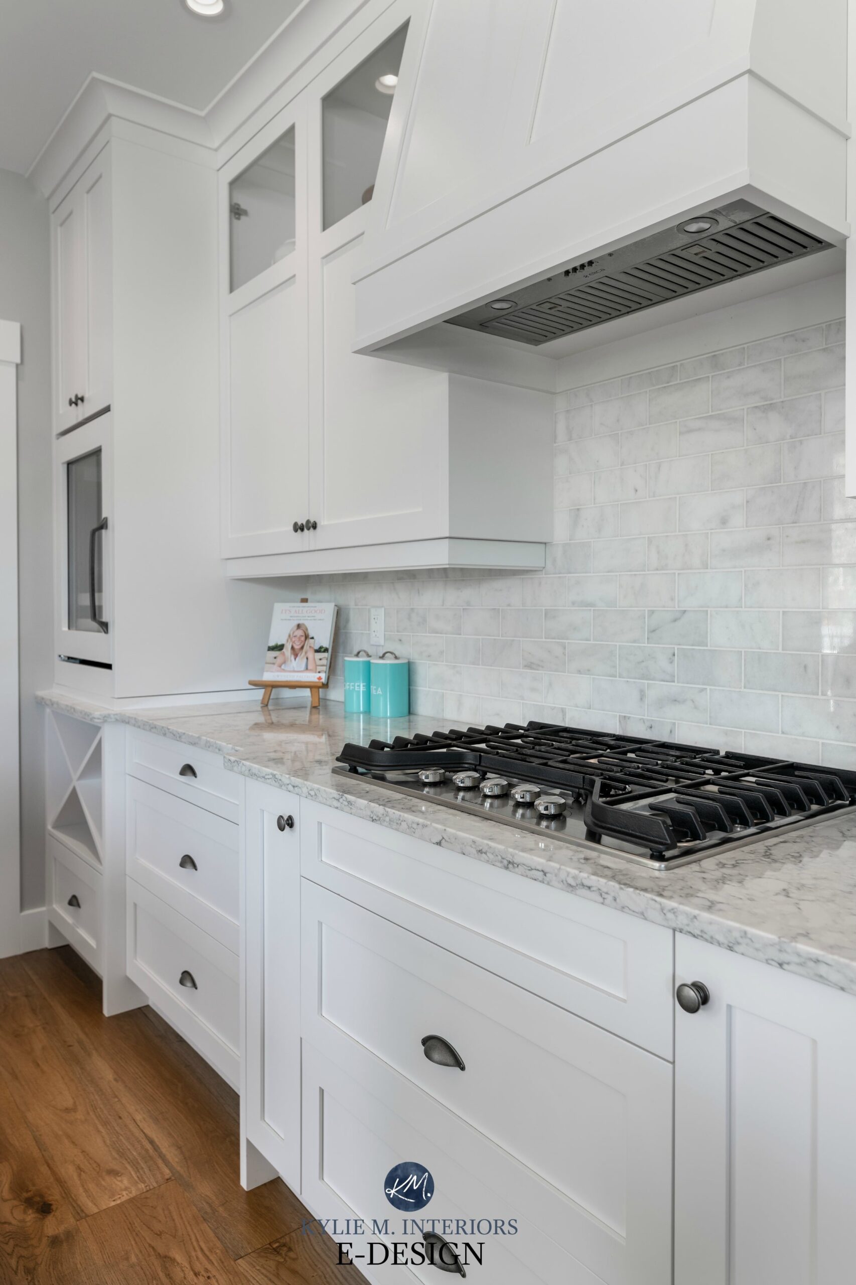 Kitchen with Sherwin Williams white cabinets, LG quartz countertop, marble subway tile backsplash white oak flooring. Kylie M INteriors Edesign, online paint colour consulting