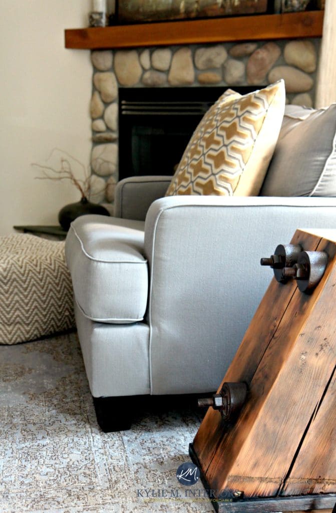 Benjamin Moore Gentle Cream, Urban Barn gray toned rug and accent chair. Riverstone fireplace, reclaimed wood side table. Kylie M Interiors E-decor and Online Design