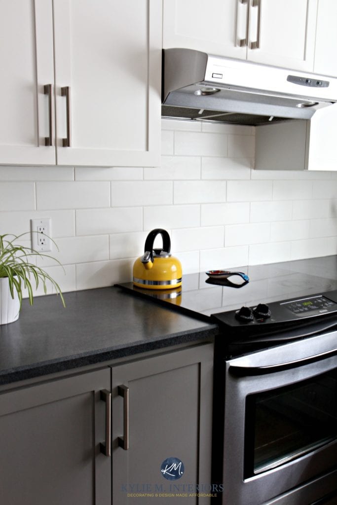Budget friendly kitchen with painted cabinets Benjamin Moore Chelsea Gray, white subway tile and black laminate countertops. Kylie M Interiors Online Color Consulting and E-design