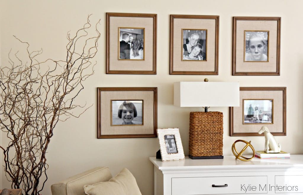 Family photo gallery wall beside the TV. Home Decor and Benjamin Moore Gentle Cream walls