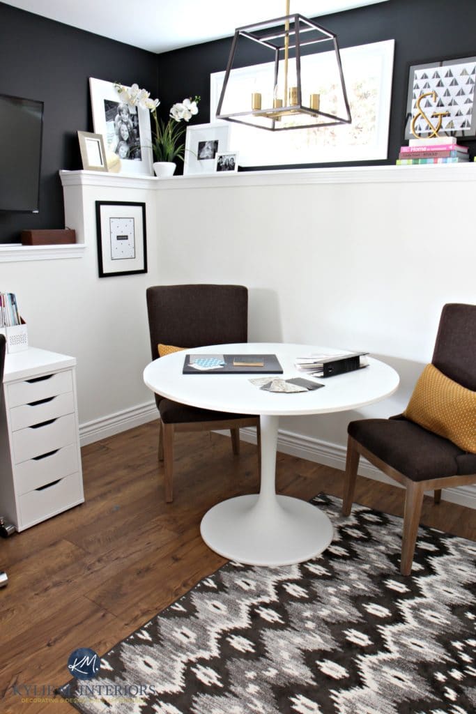 Home office with ikea table, desk. Sherwin Williams Tricorn Black feature with Benjamin Moore Cloud White on foundation wall