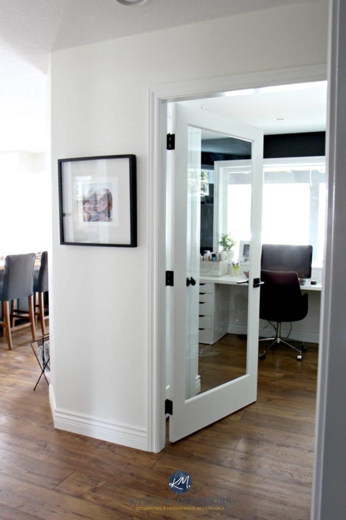 Sherwin Williams Creamy with glass french door into home office with black feature or accent wall. Kylie M Interiors E-decor and color consulting