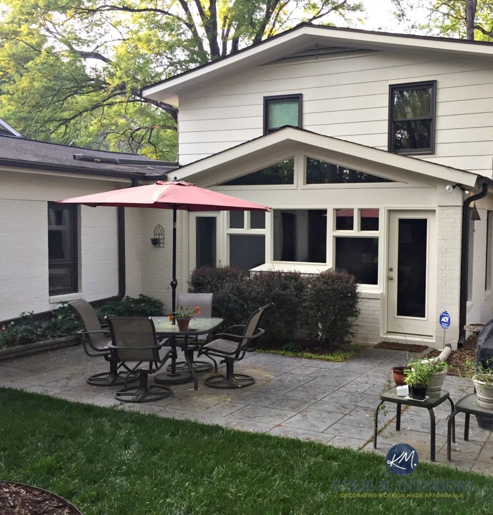 Exterior, painted brick and siding in Ballet White. dark brown trim. Kylie M Interiors E-design and Online Colour Consulting and Decorating services