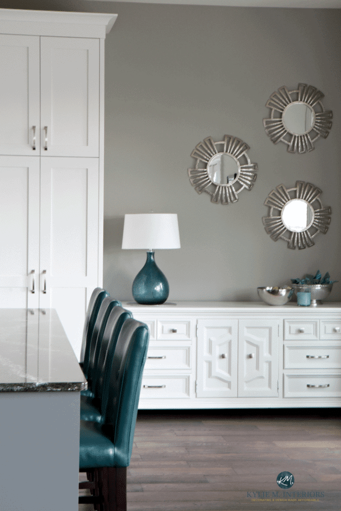 Sherwin Williams Dorian Gray, white kitchen cabinets and buffet, teal accent stools and home decor. Kylie M Interiors and Alair Homes Nanaimo