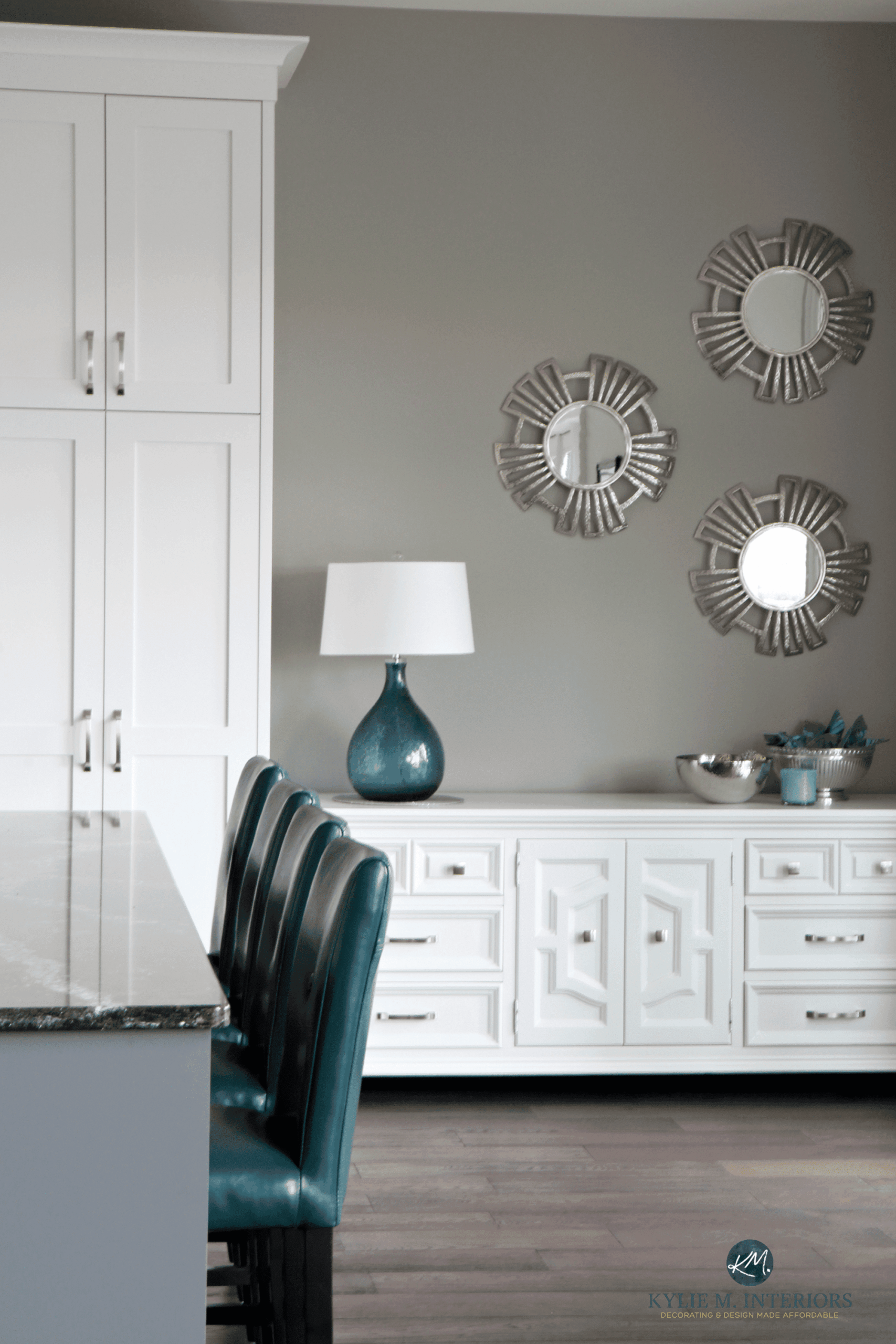 Sherwin Williams Dorian Gray, white kitchen cabinets and buffet, teal accent stools and home decor. Kylie M Interiors and Alair Homes Nanaimo