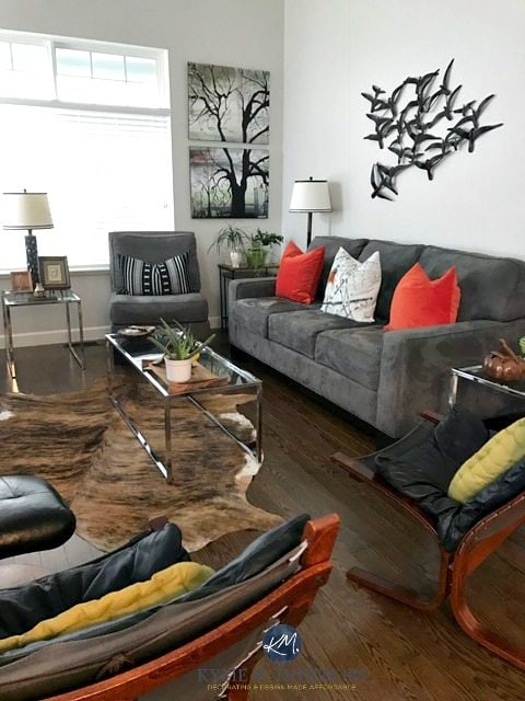 Silver Satin, Benjamin Moore in living room with gray couch, chrome accents, oak flooring and cowhide rug. Transitional style. Kylie M Interiors E-design and Virtual Colour consulting