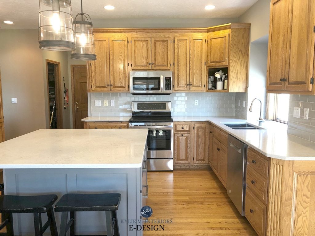 Golden oak kitchen cabinets with white q
