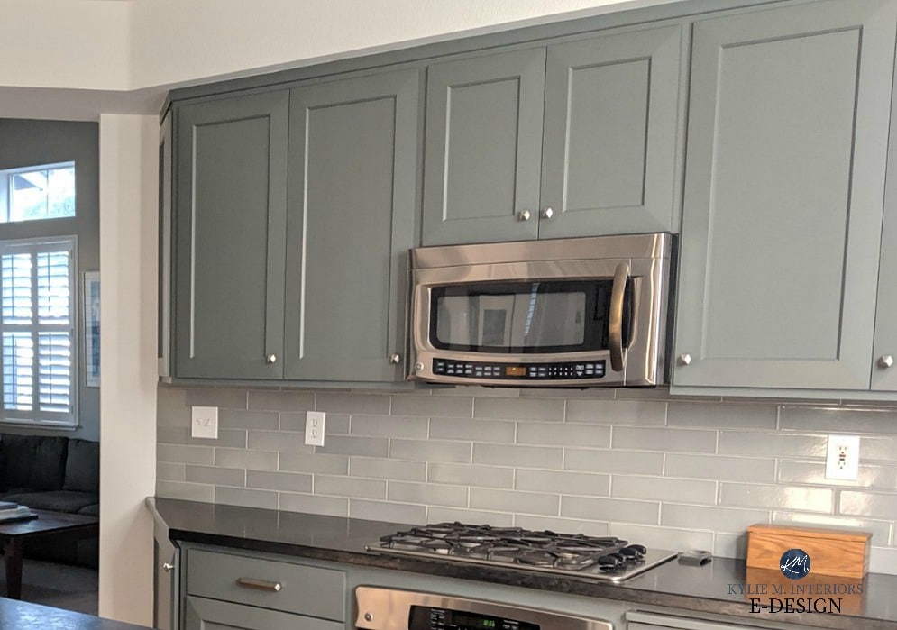 Kitchen cabinets, shaker style doors painted Benjamin Moore Kitty Gray lightened, blue green gray backsplash tile, black countertops, stainless appliances. Kylie M INteriors Edesign, client photo (1)