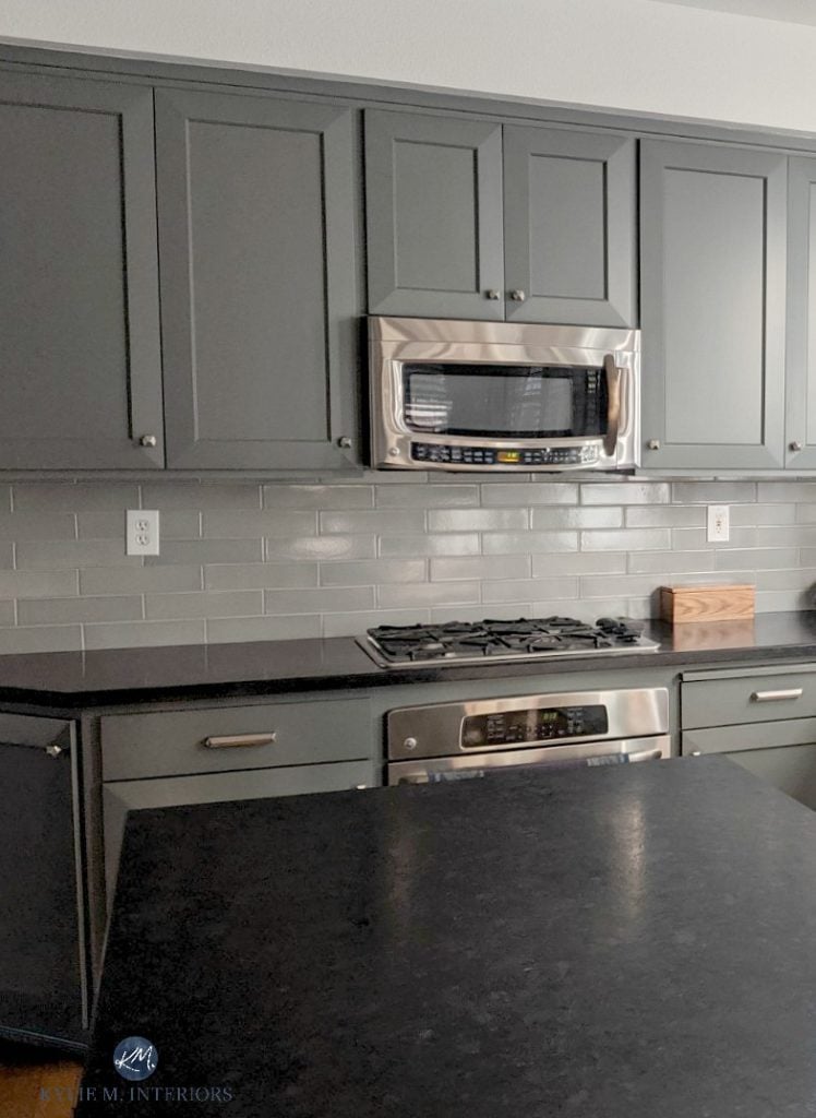 Kitchen cabinets, shaker style doors painted Benjamin Moore Kitty Gray lightened, blue green gray backsplash tile, black countertops, stainless appliances. Kylie M INteriors Edesign, client photo (2)