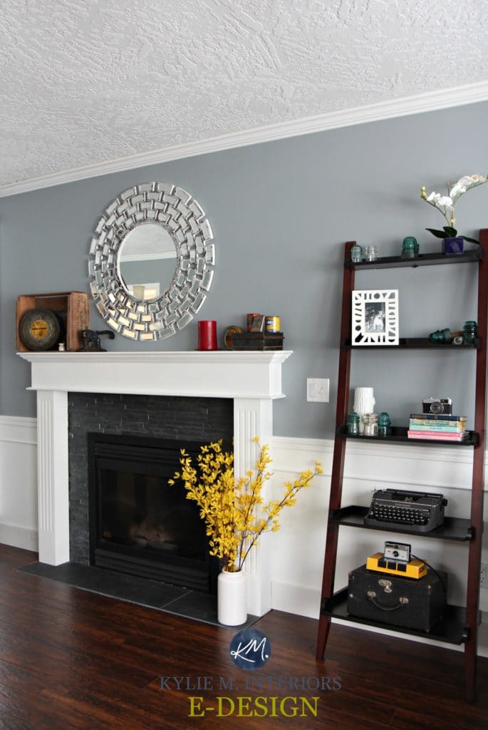 Sherwin Williams Network Gray in living room, white wainscoting, fireplace and mantle. Red toned wood flooring. Kylie M Interiors E-design and online colour consulting and blog