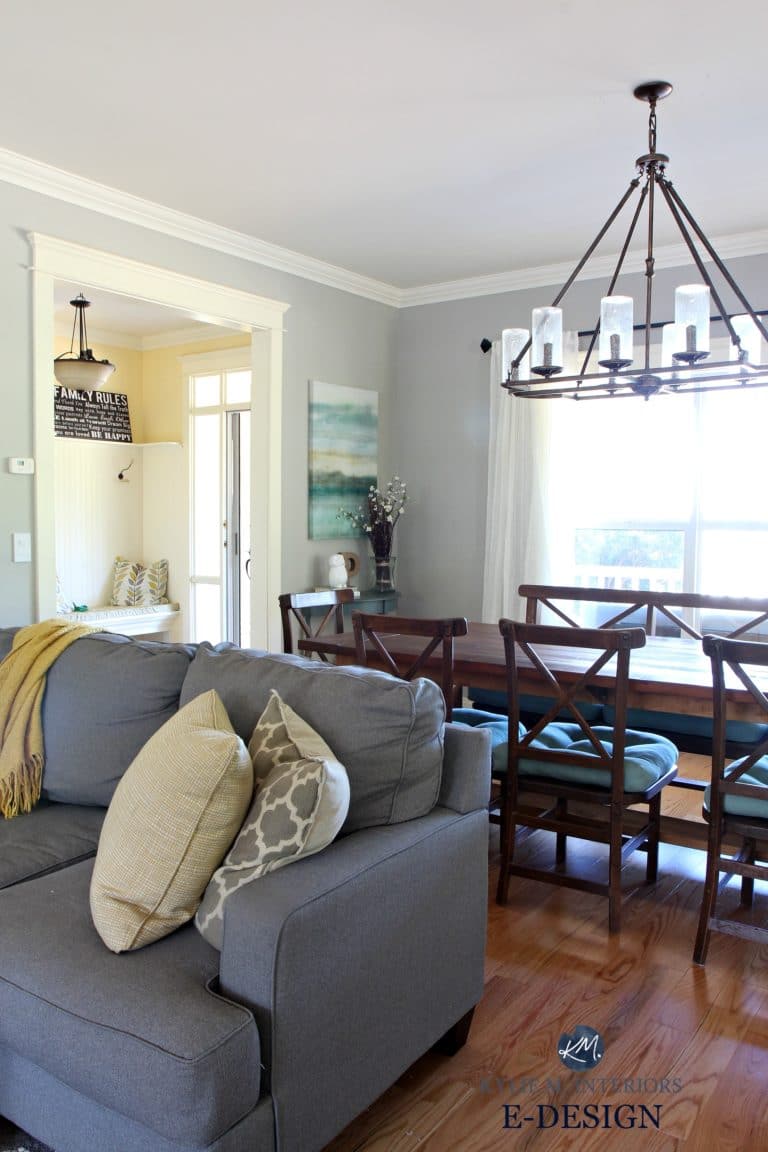 Benjamin Moore Revere Pewter in living room with gray sectional. Yellow entryway, farmhouse style table and light. Kylie M E-design