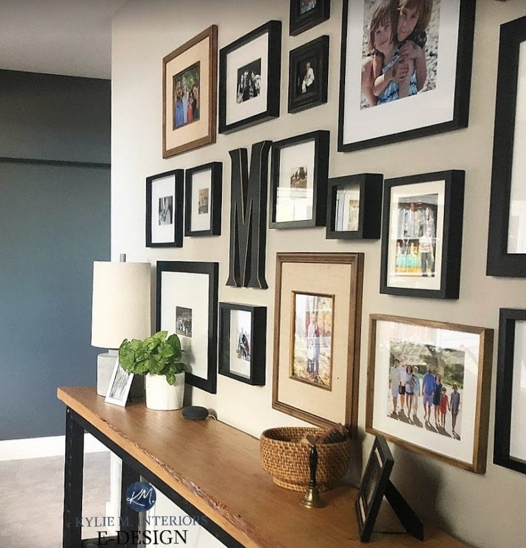 Best dark paint color for dark room. Sherwin Williams Grizzle Gray and Colonnade, Kylie M INteriors Edesign, online paint colour expert. Family photo wall gallery
