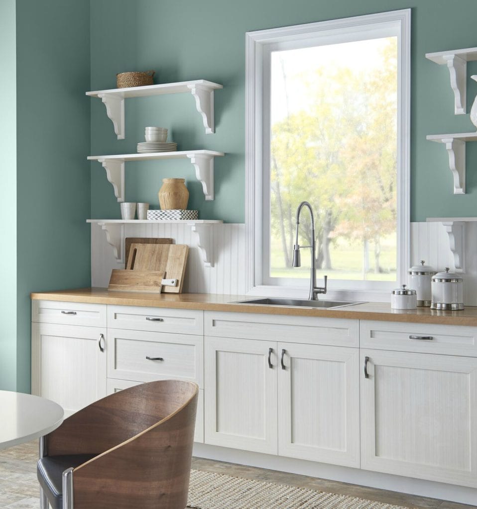 Behr In the Moment in a kitchen with white country style cabinets and butcher block countertop. Info via Kylie M Interiors E-design blog. Photo via Behr
