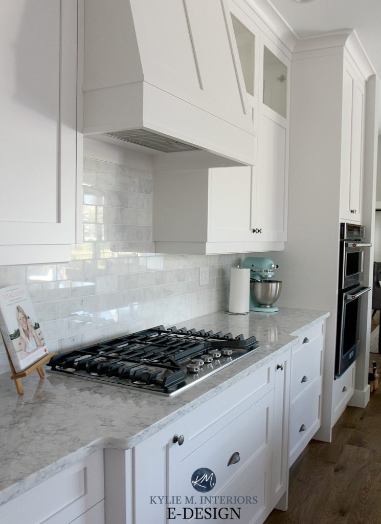 LG white quartz kitchen countertop, High Reflective White cabinets, subway marble tile backsplash. Kylie M Interiors Edesign, online paint color blogger and consultant